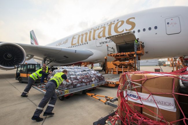 Emergency shelter items are loaded on board of an Emirates A380 flying from Hamburg to Dubai