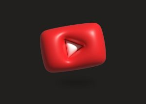 Červené logo webové stránky YouTube na černém pozadí