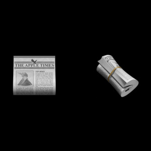 Noviny v otevřené i srolované podobě ukazují nápis „The Apple Times” Noviny v otevřené i srolované podobě ukazují nápis „The Apple Times”