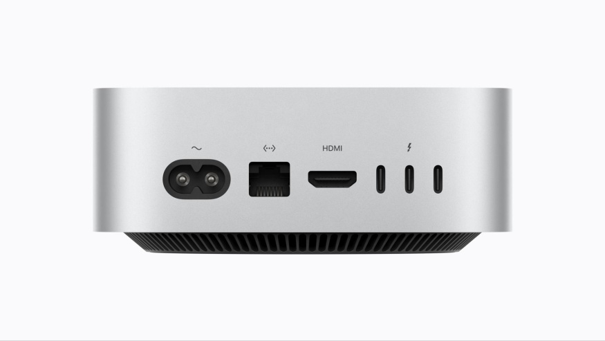 Zadní konektory Macu mini M6 Zadní strana Macu mini M6 s napájením, ethernetem, HDMI a třemi konektory Thunderbolt ve tvaru USB-C